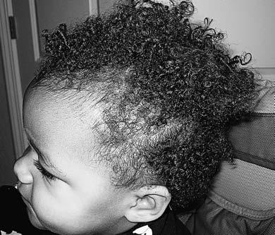 Before bedtime, if her hair is long enough, put her curls in several braids, two-strand-twists, or buns to keep them smooth while she sleeps.