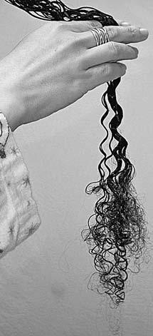 You re finished with a section when you move out that last tangle. For very curly hair, the difference between combed and not yet combed will be obvious.