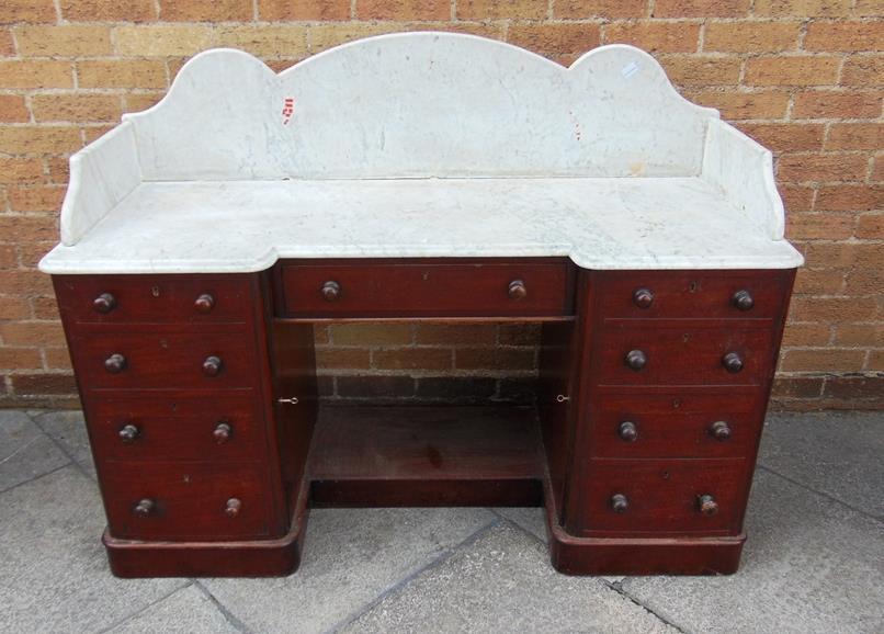 VAT) Lot 375 375 A LARGE MARBLE TOP WASHSTAND on twin pedestal mahogany base fitted with frieze drawer flanked by cupboards with faux drawers, 137cm wide 53cm deep 130.5cm high 120-180 (plus 23.
