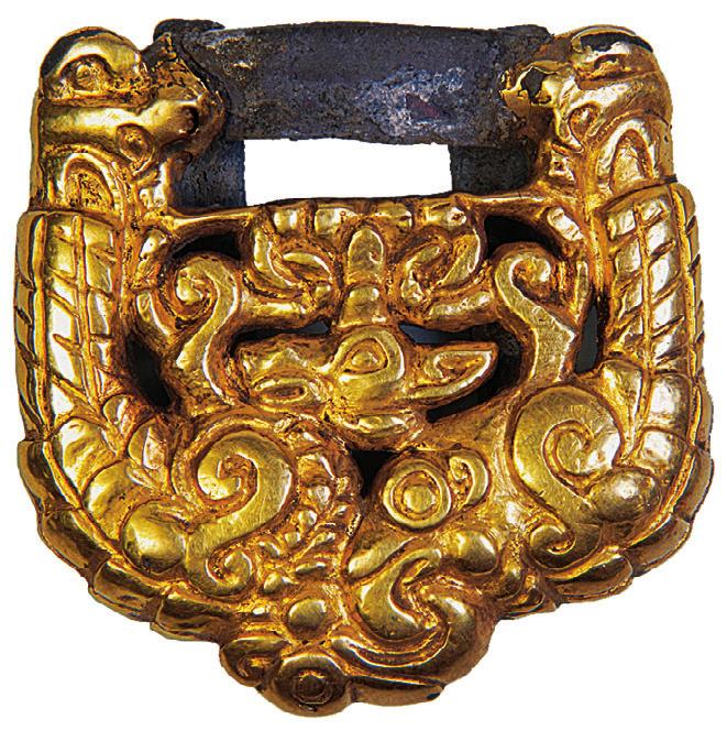 This buckle depicts an eared griffin and a panther, just like the composition mentioned above from Kurgan 16 (see fig. 8). At the left hip, we also found an iron war axe.