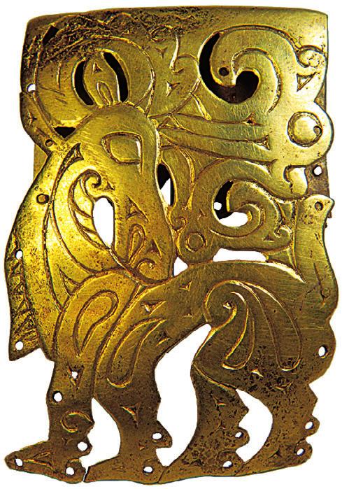 2010] EARLY NOMADIC BURIALS AT FILIPPOVKA, RUSSIA 139 Fig. 17. Golden overlay for wooden vessel (depicting a deer) from Kurgan 4, Burial 3 (A. Mirzakhanov). wrists were massive golden cast bracelets.