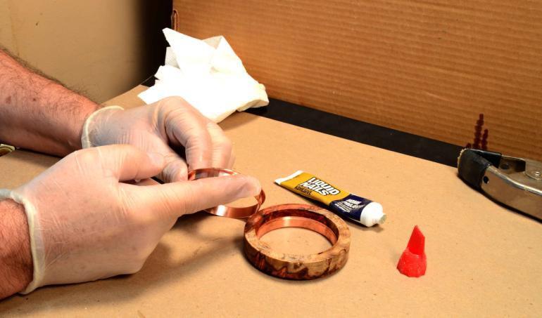 Step Ten: Wearing gloves to protect your hands from the glue, apply the glue to both the inside of