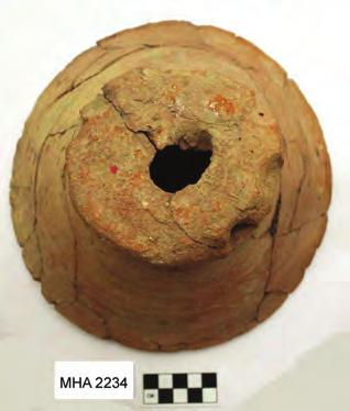 quite large, approximately 2 cm in diameter. The Jaffa flowerpots were recovered from a single locus that is interpreted as an open-pit firing associated with the Egyptian garrison kitchen.