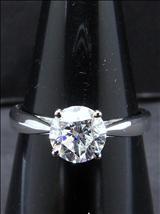 Lot: 219 A 18K WHITE GOLD DIAMOND RING set with a solitaire round diamond weighing 1.01cts, of F colour and VS1 clarity, excellent polishing, fair cut and symmetry, none fluorescence. Total weight 2.