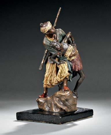 $2,000-4,000 578 579 Franz Bergman Austrian Cold-painted Bronze Figure of an Arab Weapons Merchant, early 20th century, the figure seated on a rug, holding a sword, with additional weapons spread out