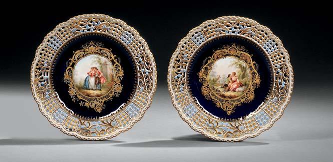 585 585 Pair of Meissen Porcelain Hand-painted Cabinet Plates, Saxony, late 19th/early 20th century, each with central circular unsigned polychrome enamel-decorated scene of a courting couple in a