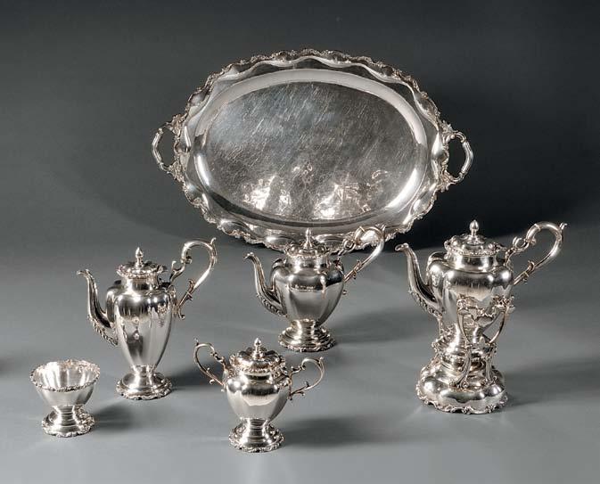 156 156 Seven-piece Mexican Sterling Silver Tea and Coffee Service, mid-20th century, lacking maker s mark, each with lobed, inverted baluster body offset by scrolled register to mouth and footrim,