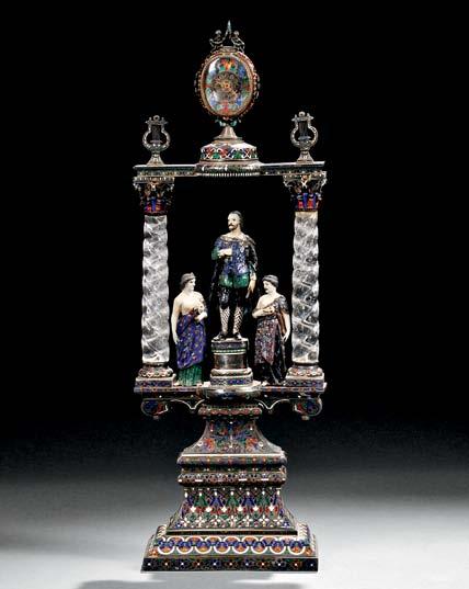 $1,200-1,800 179 177 Viennese Silver, Enamel, and Freshwater Pearl Figural Clock, Austria, late 19th century, modeled as a violinist standing atop a raised cylindrical column set with a clock, the