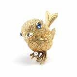 AS- 41 A sapphire bird brooch, Van Cleef & Arpels Signed VCA for Van Cleef & Arpels #B2516, 18K gold, the bird is set with two cabochon sapphire eyes and offset with a small cultured pearl egg, 1