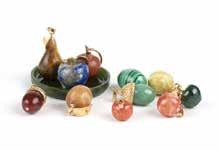 2 grams, est: $800/1200 127 A group of hard stone carved fruit pendants Including 10 hard stone carved pendants of fruit in malachite, aventurine quartz, coral, lapis
