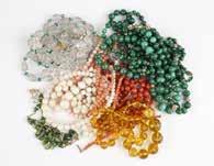 collection of beaded necklaces Of angel skin, red and white coral, malachite and gold beads,