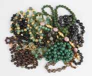 large group of stone, gold & costume jewelry Including: hardstone and gold bangles, onyx,
