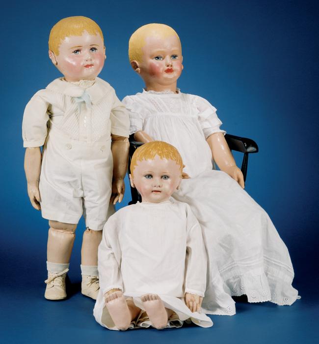 1351 1353 1352 1354. Three Assorted Dolls, 1930s, Nora Wellings brown velveteen native with glass eyes, in mustard-yellow overalls, ht. 16 3/4; composition and cloth Charlie McCarthy, ht.