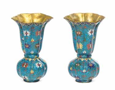$600-800 51 46* A Chinese Cloisonné Enamel Vase, of lobed baluster form, having foliate decoration depicting birds amongst flowering peonies, with scrolling lotuses, raised on a hardwood base.