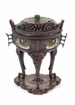 50* A Chinese Champlevé Censer and Cover, the censer of circular form with upright loop handles, archaistic bird decoration and flanges, with a pierce carved wood cover, raised on a sinuous tripod