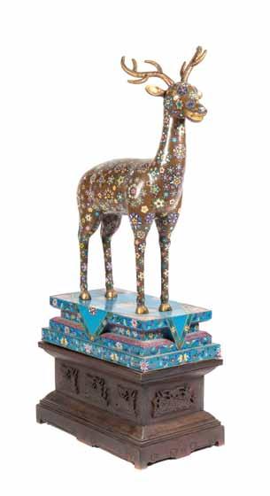 55* A Chinese Cloisonné Enamel Model of a Spotted Deer, shown in a forward facing standing pose, having gilt antlers and highlights throughout, the main body having