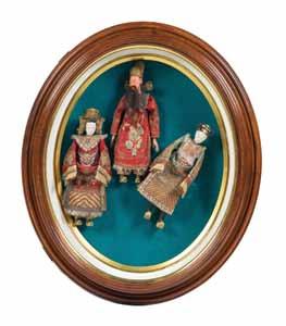 57* Three Chinese Dolls, Early 20th Century depicting Peking Opera characters, framed in a shadowbox frame. Height overall 27 1/4 inches.