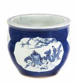 91* A Blue and White Fish Bowl, of rounded form, having foliate decoration at the mouth rim and depicting a watery landscape, with pine tree and cranes carved in low relief in the foreground and