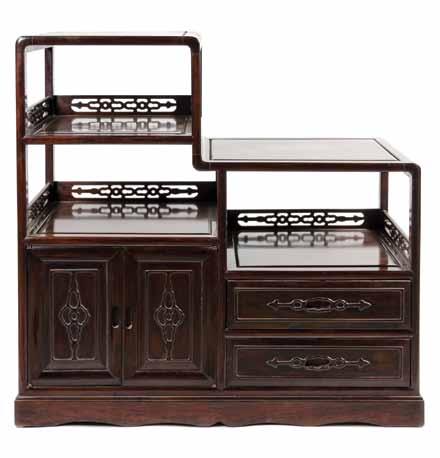 $100-200 123* A Chinese Wood Cabinet, the top register having double doors flanked by reverse opening single doors, each with figural panels, above four relief carved drawers with ruyi form handles,