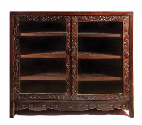 $200-400 147* A Chinese Hardwood Chest, of rectangular form, the wood with a honeyed tone and striped grain, the chest with a circular lockplate and raised on a bracket base.