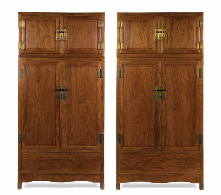 164A 164A A Pair of Huanghuali Compound Cabinets, of rectangular form, having gilt metal mounts and pierced pulls, the aprons having undulating lower borders and