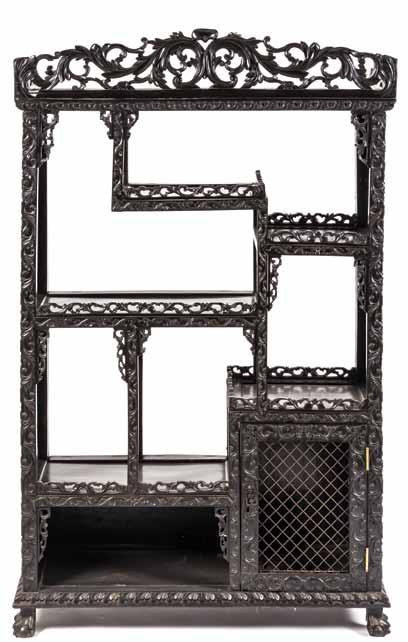 $1,000-2,000 174* A Chinese Export Hardwood Étagère, the pierce carved cornice depicting scrolled, leafy vines above the open