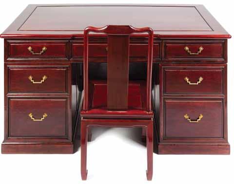 192 189* A Modern Chinese Hardwood Desk, the plank top having a slightly curved back edge and opposite a bowed edge, above seven drawers, raised on a solid