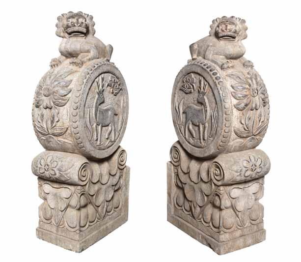 254* A Pair of Chinese Carved Stone Architectural Elements, each depicting a Buddhistic lion, recumbent atop a drum form and capital form