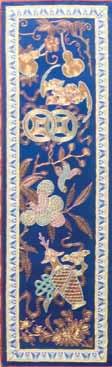 261* A Group of Four Chinese Embroidered Silk Panels, the first depicting peacocks, cranes, butterflies, lotus and peonies on a deep blue ground, the second depicting double