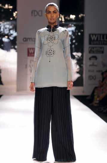 reviews Monochromatic Minimalism Am:pm by Ankur & Priyanka Modi The creative couple of am:pm chiseled a bold and curvilinear muse for their collection Tribus.