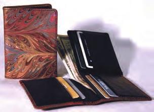 35 8"x 4¼" G. Men s Trifold Wallet LAC057 Holds cards with center ID window.