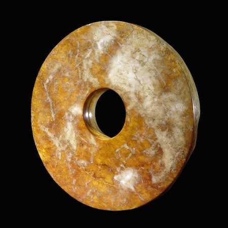 Jade discs have been found carefully laid on the bodies of the dead. The term bi is applied to wide discs with proportionately small central holes.