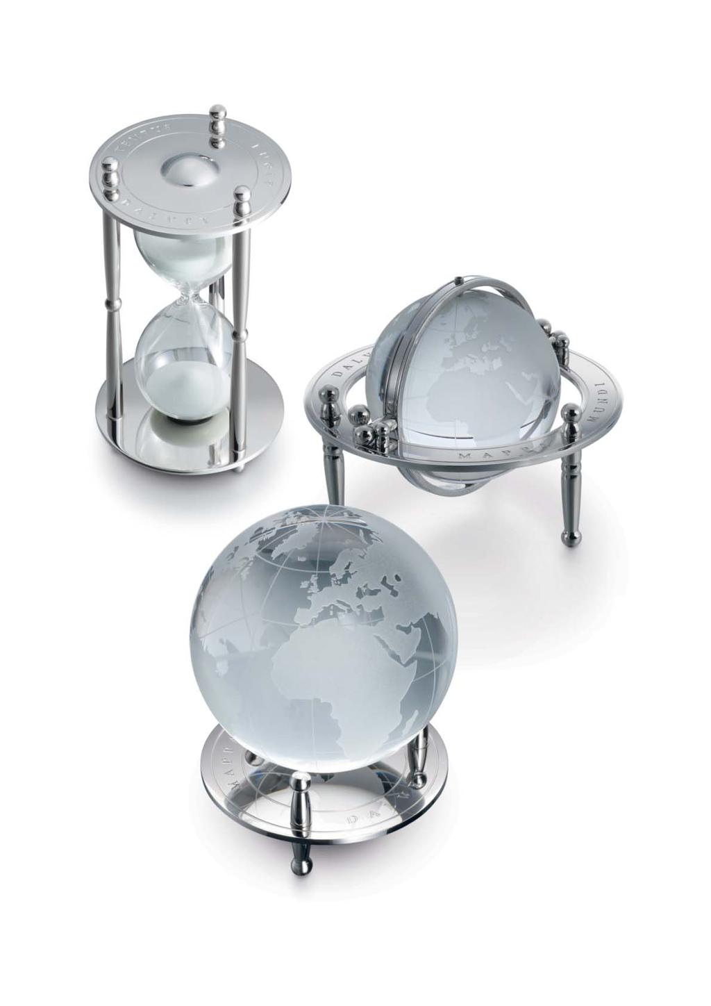 GIMBAL GLOBE An etched orb of crystal glass revolves in all directions in this striking gimbal cradle.