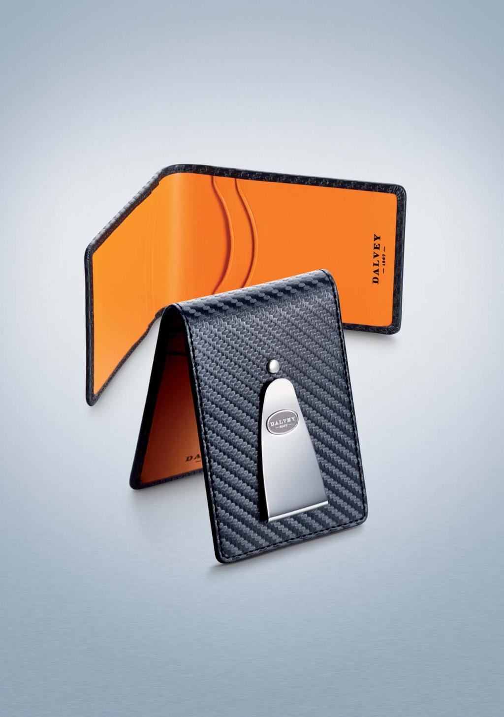 INSIGNIA WALLET The Insignia Wallet dramatically employs the sober and exuberant combination of vibrant orange and richly