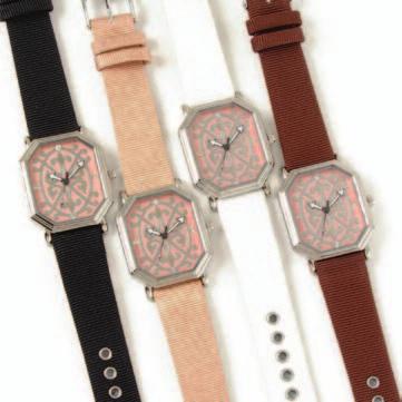 design layered on matching leather band, highlighted by crystals around the case.