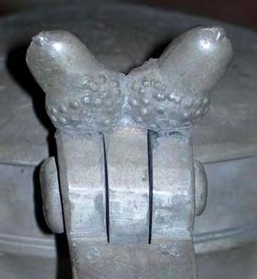 2) The mark to the back of the handle may be a kind of fleur de lys - that I have not seen it ever before, does not mean it is not for real. 3) The hinge lug and acorns.