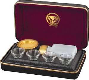 Inside, two lids are separated by a black cloth divider to cover the unused serving components when serving communion.