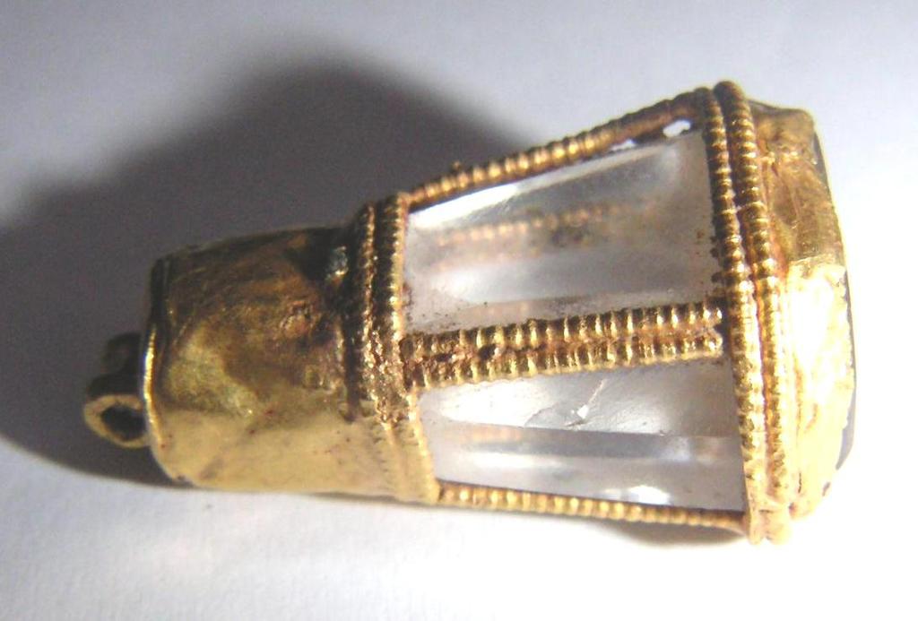 Fig. 14a-b. Rock crystal intaglio in gold setting Fig. 15. Rock crystal faceted bead Fig. 16.