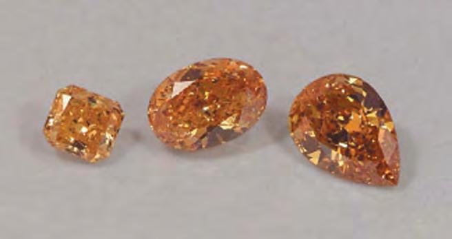 Figure 4. These three diamonds (1.03 2.80 ct) are in the same hue range and of approximately the same saturation. The differences in appearance are due to variations in tone (i.e., relative lightness or darkness), all of which are within the range that would be described in GIA s colored diamond color grading system as Fancy Vivid yellow-orange.