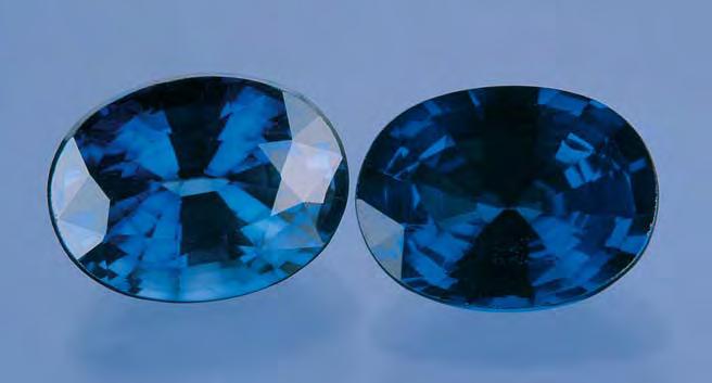 Figure 12. These two sapphires (2.74 and 2.23 ct) were submitted to the laboratory together. The lighter one (left) showed evidence of standard diffusion treatment with titanium.
