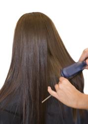 Flat iron the hair for a beautifully smooth and shiny finish.
