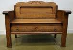 Page: 17 149 QUARTER SAWN OAK BENCH -full length drawer with brass pulls, applied carvings. Size: 31 x 40 x 21 in. 450.00-600.
