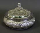 Page: 2 10 STERLING SILVER COVERED DISH -embossed throughout with leaf detail and acorn finial. Stamped Industria Argentina 925 to the base. Weight: 1090 gm 600.00-800.