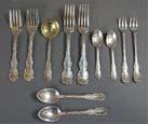 Consists of: five table forks, five table spoons, one cream spoon, twelve cocktail forks, five tea spoons, one fish fork, ten salad forks and three coffee spoons. Weight: 1145 gm. 800.00-1,200.