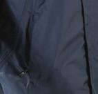 Drawstring at bottom hem, backside of jacket curved and longer than the front. Taped seams.