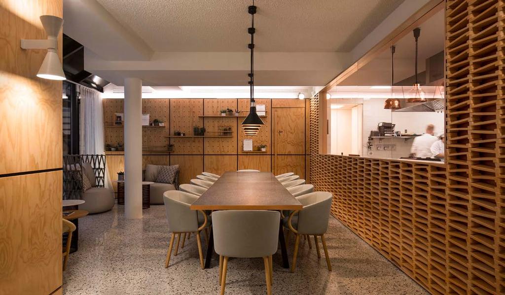 he ground floor, outfitted with a single central table, overlooking the open-plan kitchen, is used to host private events, or is available for those wishing to socialize and indulge in a communal