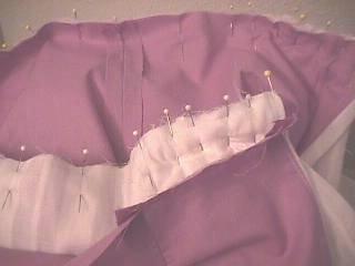 G. If you are making a lined skirt, hem the edges of the placket by narrowly turning under twice and hemming, then turn under both sides of the placket to the inside of the dress and