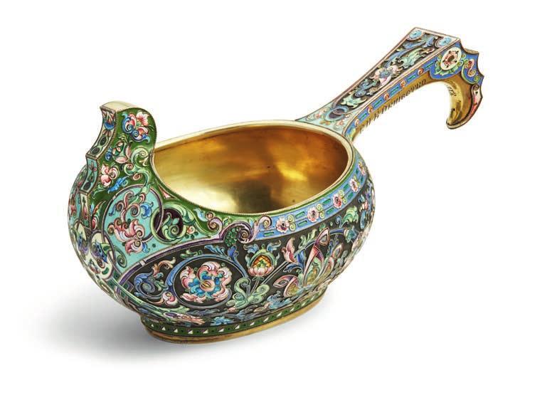 811 811 THE 11TH ARTEL, MOSCOW 1908-1917 A large Russian silver-gilt and enamelled kovsh, of traditional oval form with a hook shaped handle and raised prow, richly decorated with shadowed scrolling