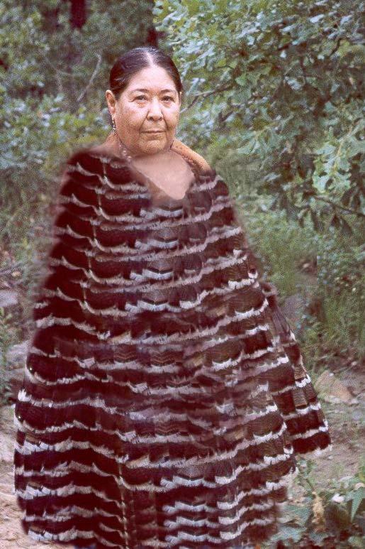 For the image above an editing program was used to make it look like the feathers went full-length. Although Nora had been unable to complete her own feather cape she was able to make one eventually.