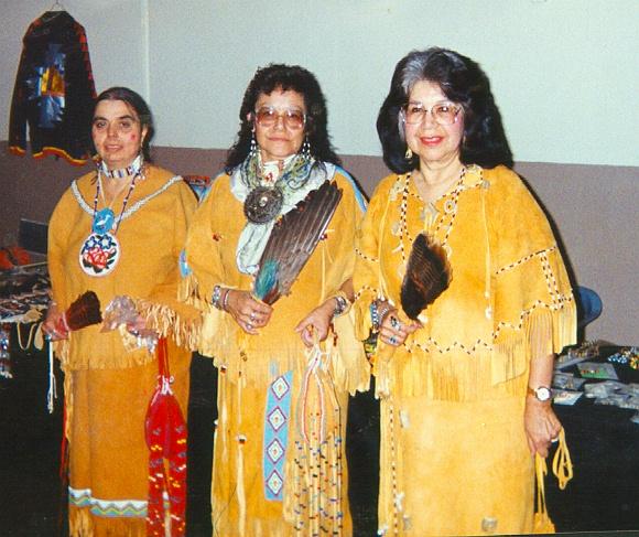 Other tribal members liked the look of the deerskin clothing and also made their own dresses as in this photograph of Louise Dean, Betty Skye, and Mary Louise Watters at a powwow in Dewey, Oklahoma.